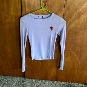 Purple shirt with a rose in the corner! XS